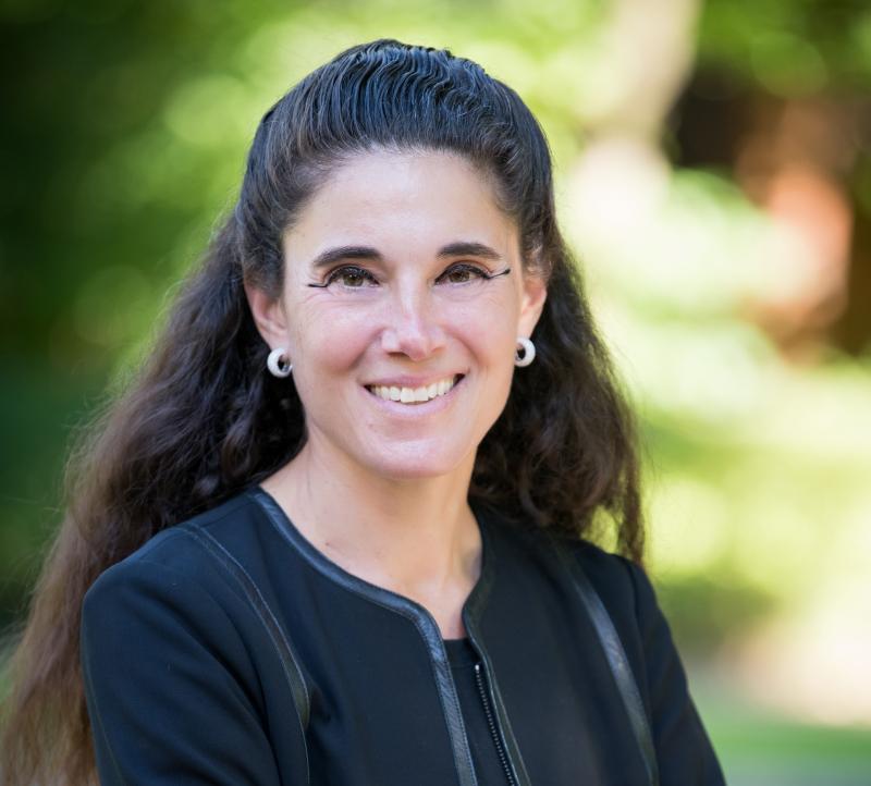 Photo of Dr. Jill Barnholtz-Sloan against a green background