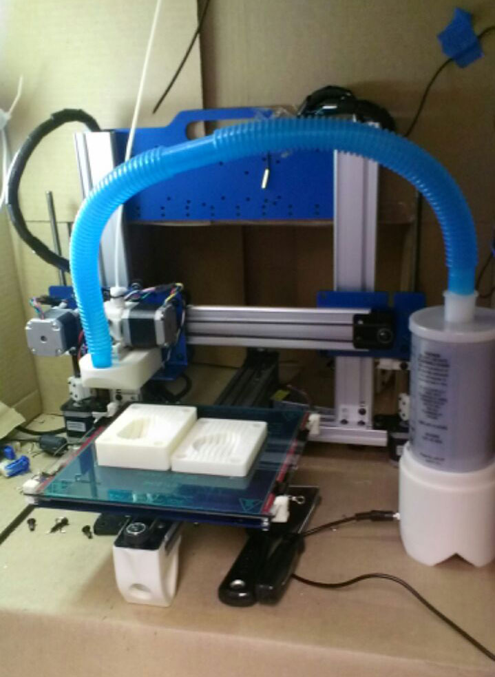 3D printer with two-part prostate mold sitting on a countertop