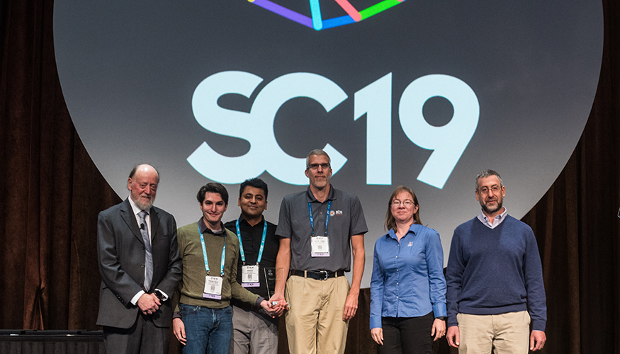 SC19 Winners of Best Paper for modeling cancer-causing protein interactions. Paper is titled: "Massively Parallel Infrastructure for Adaptive Multiscale Simulations: Modeling RAS Initiation Pathway for Cancer."