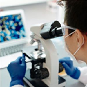 Colored image of scientist peering through microscope and sample.