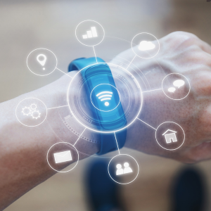 Image of a wearable device on a wrist with technology icons coming out.