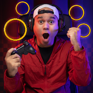 Person with headphones on, holding a game controller and cheering. Gold rings in the background. 